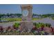 Community entrance sign for The Preserve at Pine Lakes with landscaped flowers and a pond at 5310 Knobcone Loop # B, Myrtle Beach, SC 29577