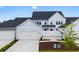 Charming townhome featuring an attached garage, sidewalk and lawn at 5310 Knobcone Loop # B, Myrtle Beach, SC 29577