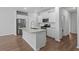 Well-equipped kitchen with island, granite countertops, and stainless steel appliances at 5310 Knobcone Loop # B, Myrtle Beach, SC 29577