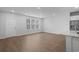 Bright and airy living room featuring large windows and hardwood floors at 5310 Knobcone Loop # B, Myrtle Beach, SC 29577