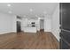 Open-concept living room with hardwood floors and contemporary decor at 5310 Knobcone Loop # B, Myrtle Beach, SC 29577