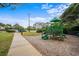 Community playground features a green playset and sidewalk leading to a gazebo in a residential area at 5310 Knobcone Loop # B, Myrtle Beach, SC 29577