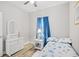 A cozy bedroom decorated with a coastal theme, dresser with mirror, and a ceiling fan at 5406 Sweetwater Blvd. # 5406, Murrells Inlet, SC 29576