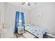 Bedroom showcasing a bed, blue curtains, and coastal-themed decor with wood-style flooring at 5406 Sweetwater Blvd. # 5406, Murrells Inlet, SC 29576
