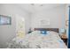 Bedroom with a king-sized bed, coastal-themed bedding, and decorative mirror at 5406 Sweetwater Blvd. # 5406, Murrells Inlet, SC 29576