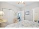 This bedroom boasts a closet and access to the connected bathroom with wood-style flooring at 5406 Sweetwater Blvd. # 5406, Murrells Inlet, SC 29576