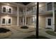 Charming condo exterior at night with cozy lighting, balconies, and manicured landscape at 5406 Sweetwater Blvd. # 5406, Murrells Inlet, SC 29576