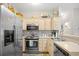 Bright kitchen with stainless steel appliances, light wood cabinets and decorative backsplash at 5406 Sweetwater Blvd. # 5406, Murrells Inlet, SC 29576