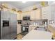 Kitchen featuring stainless steel appliances, light wood cabinets, and a decorative backsplash at 5406 Sweetwater Blvd. # 5406, Murrells Inlet, SC 29576