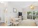 Bright living area with a dining table, wood floors, and a sliding glass door with outdoor access at 5406 Sweetwater Blvd. # 5406, Murrells Inlet, SC 29576