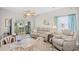 Cozy living room featuring a comfortable reclining sofa, dining table, and sliding doors to the outside at 5406 Sweetwater Blvd. # 5406, Murrells Inlet, SC 29576
