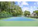 Well-maintained tennis court surrounded by lush greenery, perfect for outdoor recreation at 5406 Sweetwater Blvd. # 5406, Murrells Inlet, SC 29576