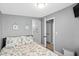 Bedroom with charming nautical decor and easy access to the ensuite bathroom at 6001 - 1732 S Kings Hwy., Myrtle Beach, SC 29575