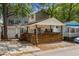 Charming home with a beautiful wooden porch and string lights, perfect for relaxing outdoors at 6001 - 1732 S Kings Hwy., Myrtle Beach, SC 29575