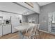Well-lit kitchen featuring white cabinetry, modern appliances, and a breakfast bar with seating for casual dining at 6001 - 1732 S Kings Hwy., Myrtle Beach, SC 29575