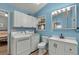 Laundry room with washer, dryer, sink, toilet, vanity and light blue walls at 6001 - 1732 S Kings Hwy., Myrtle Beach, SC 29575