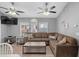 This airy living room features a comfortable sectional sofa, wood-look flooring, and plenty of light from the windows at 6001 - 1732 S Kings Hwy., Myrtle Beach, SC 29575