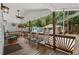 Inviting covered porch with comfortable seating and charming string lights, perfect for outdoor relaxation at 6001 - 1732 S Kings Hwy., Myrtle Beach, SC 29575