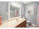 Bathroom featuring a wood vanity, large mirror, and shower/tub combination at 6001-1833 S Kings Hwy., Myrtle Beach, SC 29575
