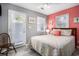 Bedroom features a bed with a patterned comforter, plus access to the outdoors at 6001-1833 S Kings Hwy., Myrtle Beach, SC 29575