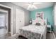 Comfortable bedroom featuring a queen bed, ceiling fan, and bright aqua accent wall at 6001-1833 S Kings Hwy., Myrtle Beach, SC 29575