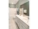 Bathroom features a double sink vanity, a large mirror, and a shower-tub combination with white tile surround at 6080 Zoe Way, Myrtle Beach, SC 29588