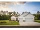 Charming single-Gathering home featuring a three-car garage, manicured lawn, and craftsman-style accents at 6080 Zoe Way, Myrtle Beach, SC 29588