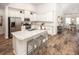 Bright open kitchen with stainless steel appliances, granite countertops, and an island with seating at 6080 Zoe Way, Myrtle Beach, SC 29588