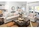Bright living room with modern decor and an open view to the dining area at 6080 Zoe Way, Myrtle Beach, SC 29588