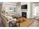 Inviting living room featuring a fireplace, natural light, and comfortable seating at 6080 Zoe Way, Myrtle Beach, SC 29588