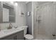 Clean bathroom featuring a sink with modern faucet, a toilet and a walk-in shower at 613 S Ocean Blvd. # N3, North Myrtle Beach, SC 29582