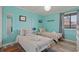Charming bedroom with twin beds, coastal decor, and lots of natural light at 613 S Ocean Blvd. # N3, North Myrtle Beach, SC 29582