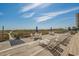 Relax on the spacious deck with ocean views, complete with lounge chairs and dining sets for seaside enjoyment at 613 S Ocean Blvd. # N3, North Myrtle Beach, SC 29582