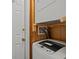 Laundry area with a stacked washer and dryer unit in a compact space, ready for use at 613 S Ocean Blvd. # N3, North Myrtle Beach, SC 29582