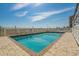 Enjoy the refreshing community pool surrounded by a well-maintained patio and safety fencing for resident enjoyment at 613 S Ocean Blvd. # N3, North Myrtle Beach, SC 29582