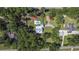 Aerial view of the property with a pool and mature trees at 62 Warbler St., Georgetown, SC 29440