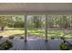 Covered porch overlooking a beautifully landscaped backyard, perfect for outdoor relaxation and entertaining at 62 Warbler St., Georgetown, SC 29440