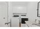 Bright and functional laundry room with modern washer and dryer units, plus ample storage space at 62 Warbler St., Georgetown, SC 29440