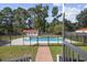 Step out to a private backyard oasis with fenced in pool, shed, and lush green lawn at 62 Warbler St., Georgetown, SC 29440