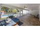 Enjoy the outdoors from this screened porch with a view of the backyard pool and hot tub at 62 Warbler St., Georgetown, SC 29440
