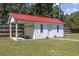 An additional shed with red roof provides additional storage at 62 Warbler St., Georgetown, SC 29440