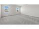 Cozy bedroom with carpeted floor and abundant natural light from two windows at 622 Castillo Dr., Loris, SC 29569
