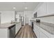 This is a spacious kitchen featuring white cabinets and stainless steel appliances at 622 Castillo Dr., Loris, SC 29569
