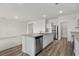 Bright kitchen featuring an island with sink and stainless steel appliances and dishwasher at 622 Castillo Dr., Loris, SC 29569