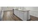 Kitchen island with white cabinets, stainless dishwasher and granite countertop at 622 Castillo Dr., Loris, SC 29569