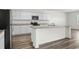 Modern kitchen featuring a large island, stainless steel appliances, and granite countertops at 622 Castillo Dr., Loris, SC 29569
