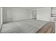 Open floor plan featuring neutral carpet and wood-look flooring and white walls at 622 Castillo Dr., Loris, SC 29569