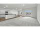 Open-concept kitchen and living room featuring granite countertops, modern appliances and a lake view at 622 Castillo Dr., Loris, SC 29569