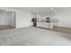 Spacious living area featuring neutral carpet, a kitchen, and natural light at 622 Castillo Dr., Loris, SC 29569