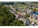 Aerial view of a townhouse complex with a lake and trees surrounding the residences at 6244 Catalina Dr. # 511, North Myrtle Beach, SC 29582